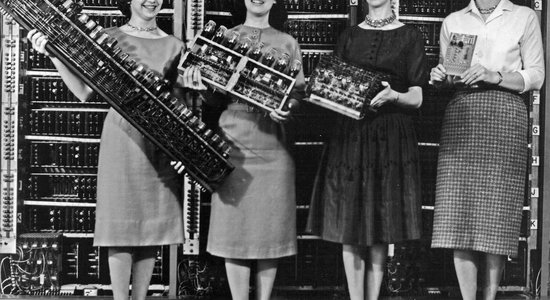 Lg women holding parts of the first four army computers